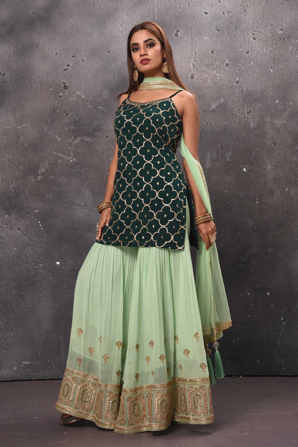 Buy beautiful mint green and dark green embroidered sharara suit online in USA. Get set for weddings and festive occasions in exclusive designer Anarkali suits, wedding gown, salwar suits, gharara suits, Indowestern dresses from Pure Elegance Indian fashion store in USA.-left