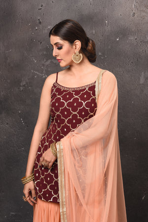 Buy stunning maroon and peach embroidered sharara suit online in USA. Get set for weddings and festive occasions in exclusive designer Anarkali suits, wedding gown, salwar suits, gharara suits, Indowestern dresses from Pure Elegance Indian fashion store in USA.-closeup