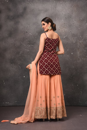 Buy stunning maroon and peach embroidered sharara suit online in USA. Get set for weddings and festive occasions in exclusive designer Anarkali suits, wedding gown, salwar suits, gharara suits, Indowestern dresses from Pure Elegance Indian fashion store in USA.-back