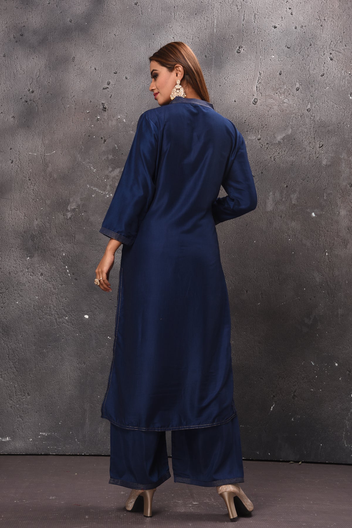 Shop beautiful solid navy blue palazzo suit online in USA with peach dupatta. Get set for weddings and festive occasions in exclusive designer Anarkali suits, wedding gown, salwar suits, gharara suits, Indowestern dresses from Pure Elegance Indian fashion store in USA.-back