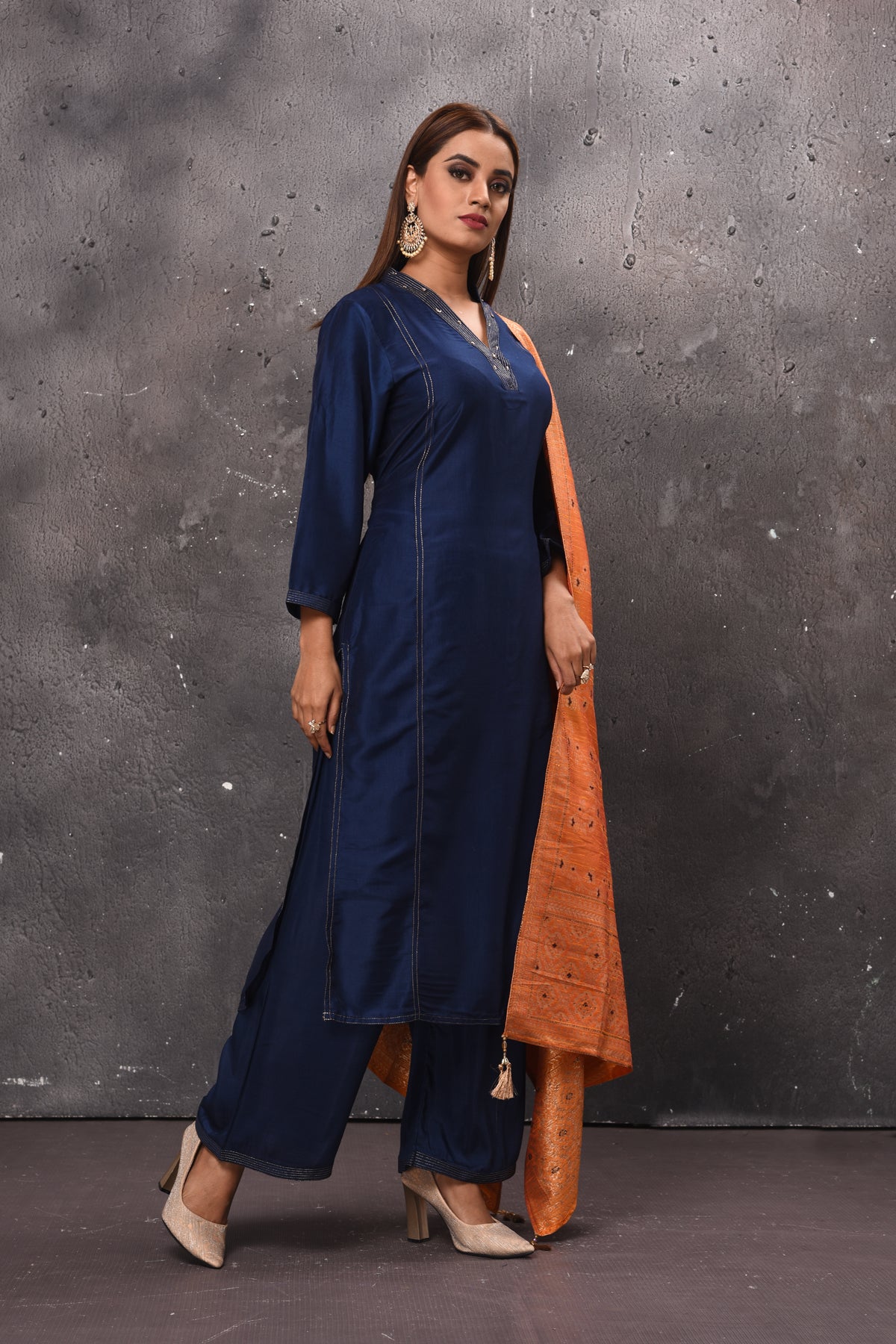 Shop beautiful solid navy blue palazzo suit online in USA with peach dupatta. Get set for weddings and festive occasions in exclusive designer Anarkali suits, wedding gown, salwar suits, gharara suits, Indowestern dresses from Pure Elegance Indian fashion store in USA.-right
