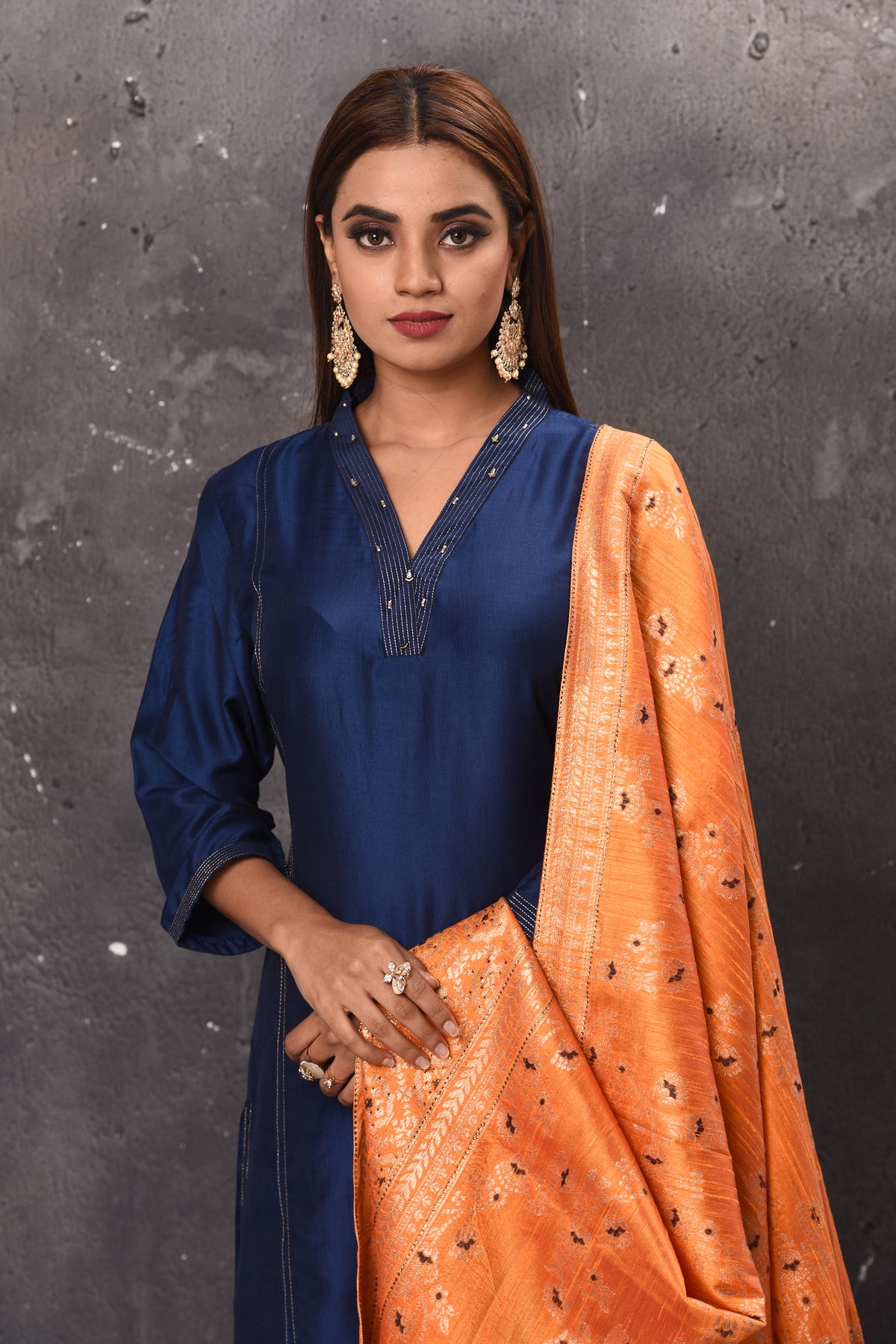 Shop beautiful solid navy blue palazzo suit online in USA with peach dupatta. Get set for weddings and festive occasions in exclusive designer Anarkali suits, wedding gown, salwar suits, gharara suits, Indowestern dresses from Pure Elegance Indian fashion store in USA.-closeup