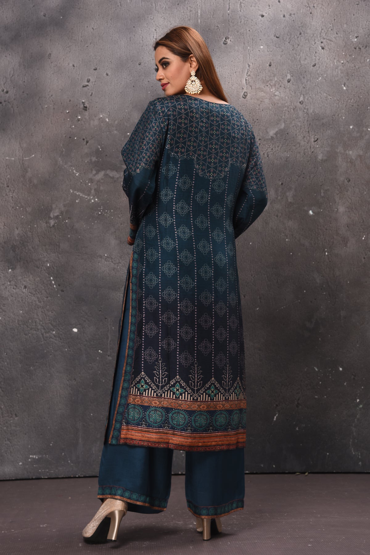 Shop teal green printed palazzo suit online in USA with dupatta. Get set for weddings and festive occasions in exclusive designer Anarkali suits, wedding gown, salwar suits, gharara suits, Indowestern dresses from Pure Elegance Indian fashion store in USA.-back