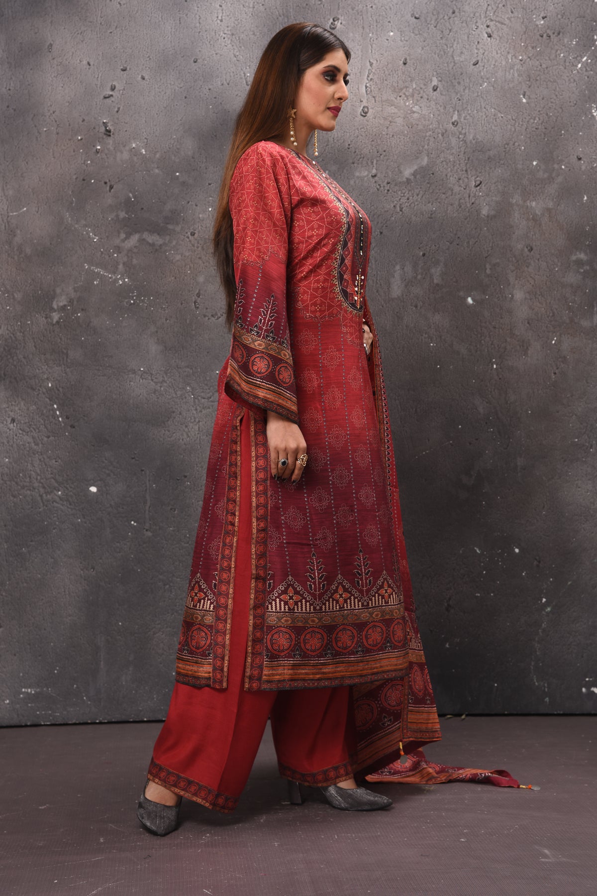 Shop stunning red printed palazzo suit online in USA with dupatta. Get set for weddings and festive occasions in exclusive designer Anarkali suits, wedding gown, salwar suits, gharara suits, Indowestern dresses from Pure Elegance Indian fashion store in USA.-side