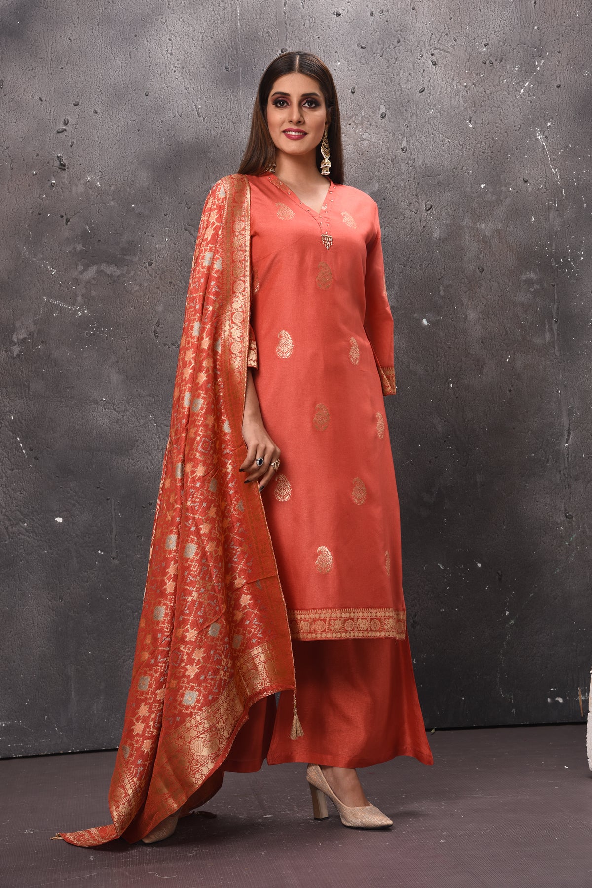 Buy elegant orange designer palazzo suit online in USA with dupatta. Get set for weddings and festive occasions in exclusive designer Anarkali suits, wedding gown, salwar suits, gharara suits, Indowestern dresses from Pure Elegance Indian fashion store in USA.-front