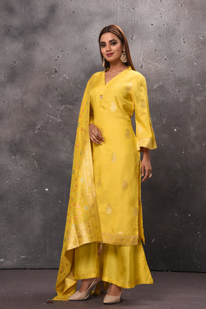 Shop stunning yellow designer palazzo suit online in USA with dupatta. Get set for weddings and festive occasions in exclusive designer Anarkali suits, wedding gown, salwar suits, gharara suits, Indowestern dresses from Pure Elegance Indian fashion store in USA.-left