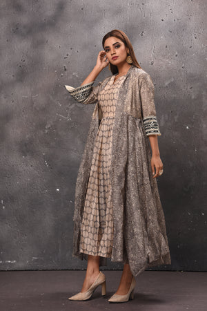 Shop stunning grey printed dress online in USA with jacket. Get set for weddings and festive occasions in exclusive designer Anarkali suits, wedding gown, salwar suits, gharara suits, Indowestern dresses from Pure Elegance Indian fashion store in USA.-left