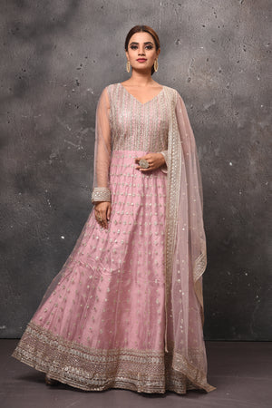 Shop beautiful light pink embroidered Anarkali suit online in USA with dupatta. Get set for weddings and festive occasions in exclusive designer Anarkali suits, wedding gown, salwar suits, gharara suits, Indowestern dresses from Pure Elegance Indian fashion store in USA.-front