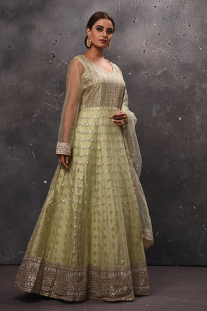 Buy beautiful pista green embroidered Anarkali suit online in USA with dupatta. Get set for weddings and festive occasions in exclusive designer Anarkali suits, wedding gown, salwar suits, gharara suits, Indowestern dresses from Pure Elegance Indian fashion store in USA.-right