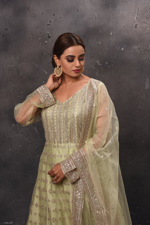 Buy beautiful pista green embroidered Anarkali suit online in USA with dupatta. Get set for weddings and festive occasions in exclusive designer Anarkali suits, wedding gown, salwar suits, gharara suits, Indowestern dresses from Pure Elegance Indian fashion store in USA.-closeup