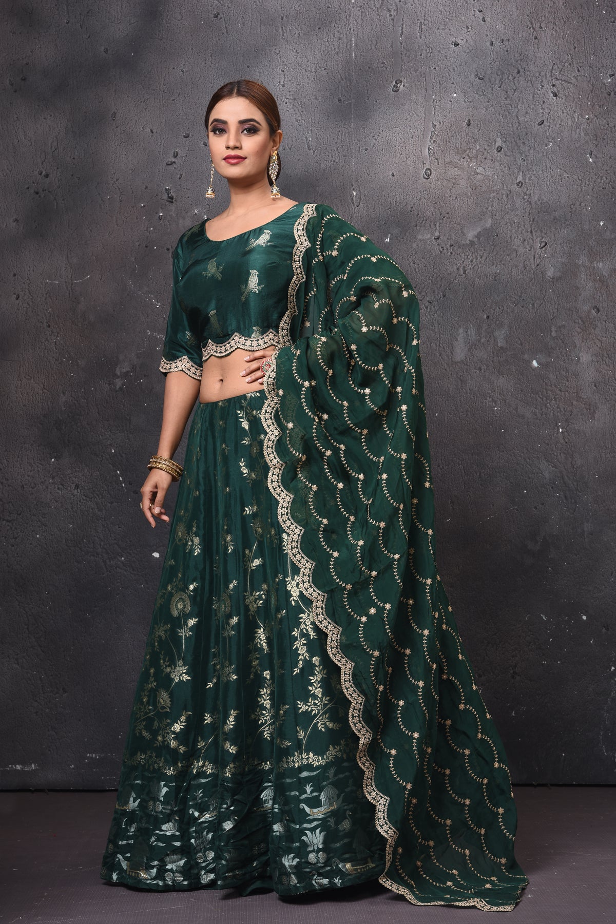 Buy beautiful dark green embroidered designer lehenga online in USA with dupatta. Get set for weddings and festive occasions in exclusive designer Anarkali suits, wedding gown, salwar suits, gharara suits, Indowestern dresses from Pure Elegance Indian fashion store in USA.-left