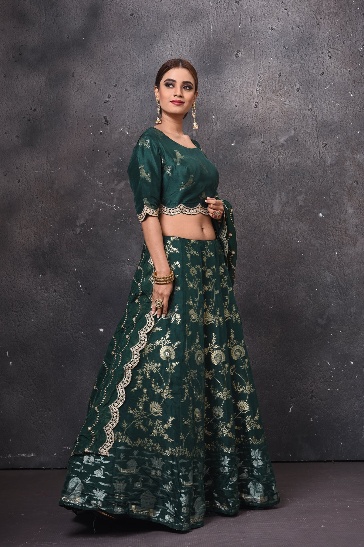 Buy beautiful dark green embroidered designer lehenga online in USA with dupatta. Get set for weddings and festive occasions in exclusive designer Anarkali suits, wedding gown, salwar suits, gharara suits, Indowestern dresses from Pure Elegance Indian fashion store in USA.-right