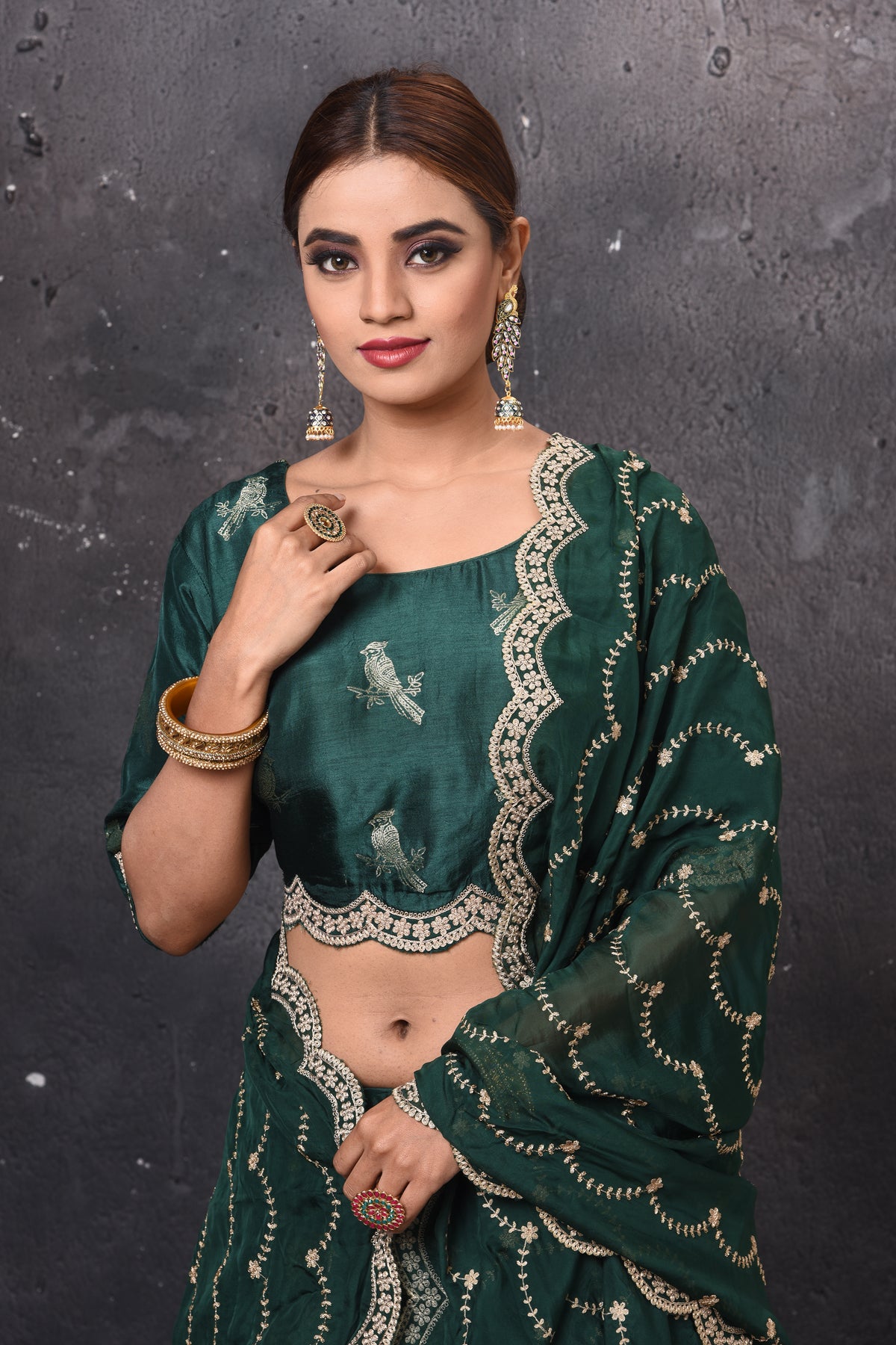 Buy beautiful dark green embroidered designer lehenga online in USA with dupatta. Get set for weddings and festive occasions in exclusive designer Anarkali suits, wedding gown, salwar suits, gharara suits, Indowestern dresses from Pure Elegance Indian fashion store in USA.-closeup
