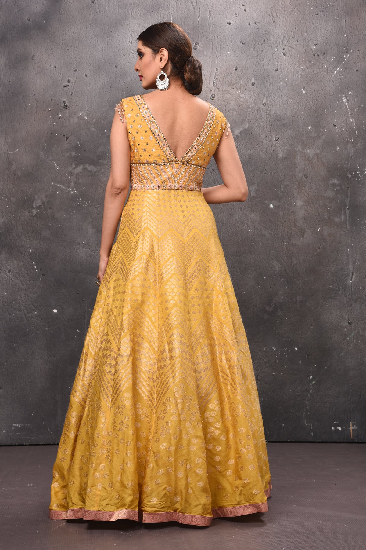 Buy stunning yellow embroidered Anarkali suit online in USA with pink dupatta. Get set for weddings and festive occasions in exclusive designer Anarkali suits, wedding gown, salwar suits, gharara suits, Indowestern dresses from Pure Elegance Indian fashion store in USA.-back