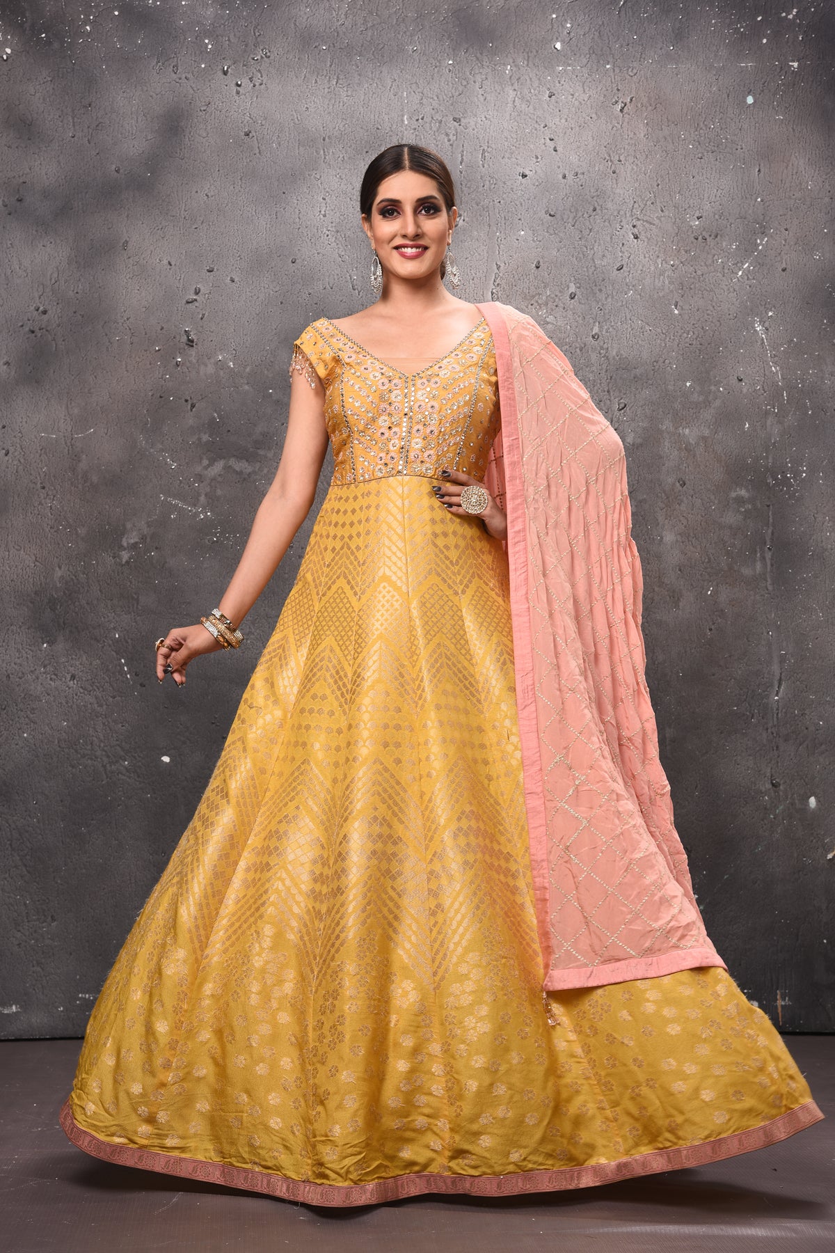 Buy stunning yellow embroidered Anarkali suit online in USA with pink dupatta. Get set for weddings and festive occasions in exclusive designer Anarkali suits, wedding gown, salwar suits, gharara suits, Indowestern dresses from Pure Elegance Indian fashion store in USA.-full view