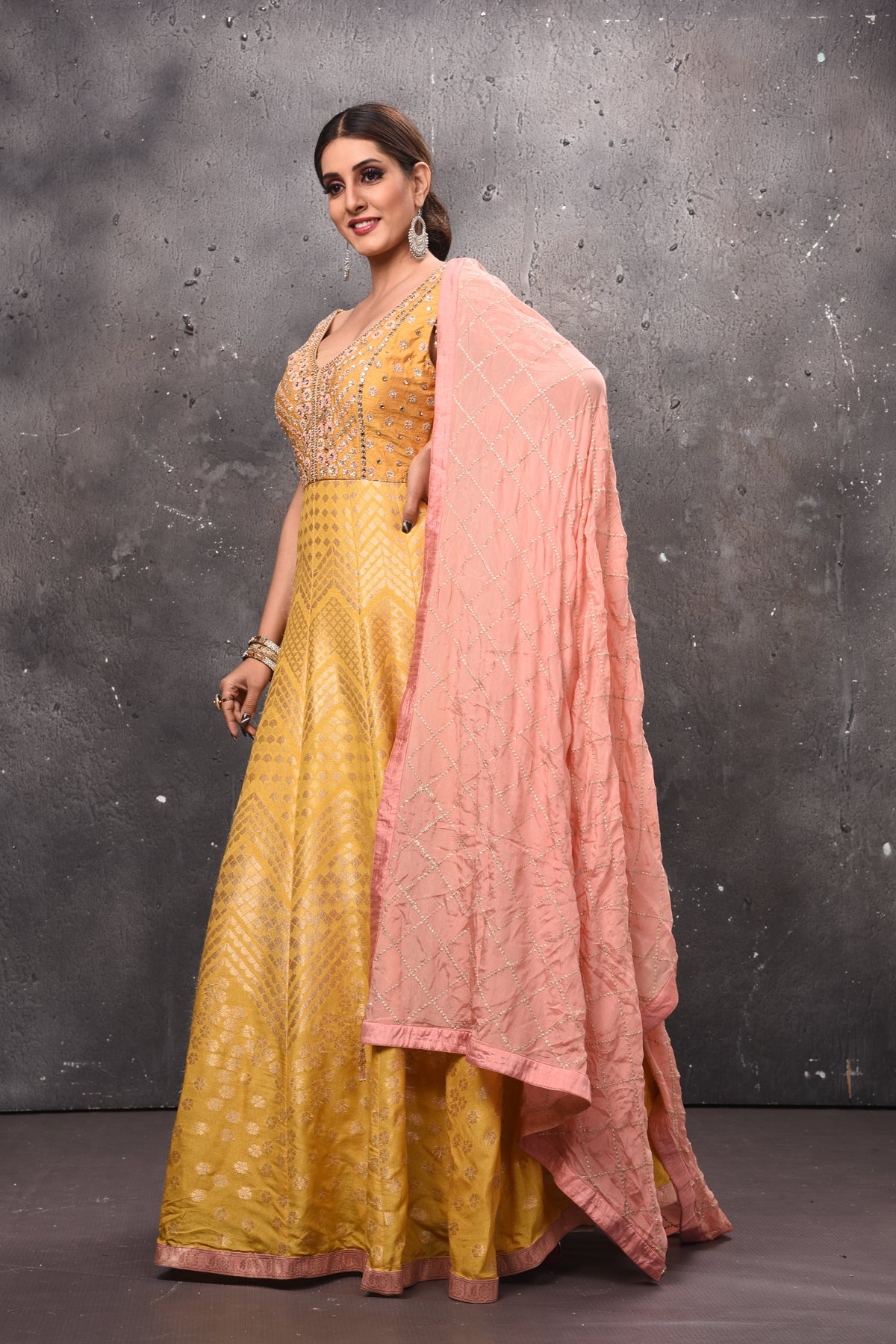 Buy stunning yellow embroidered Anarkali suit online in USA with pink dupatta. Get set for weddings and festive occasions in exclusive designer Anarkali suits, wedding gown, salwar suits, gharara suits, Indowestern dresses from Pure Elegance Indian fashion store in USA.-side