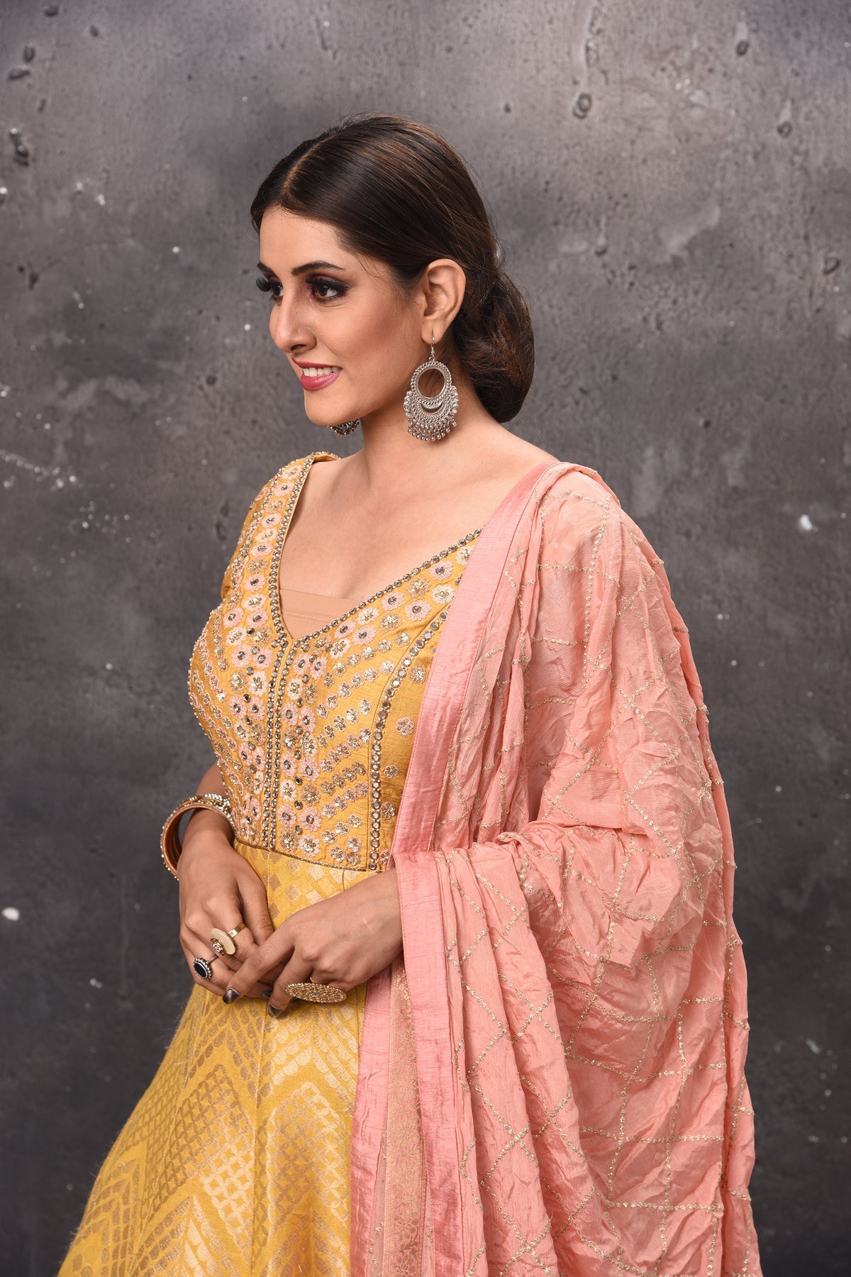 Buy stunning yellow embroidered Anarkali suit online in USA with pink dupatta. Get set for weddings and festive occasions in exclusive designer Anarkali suits, wedding gown, salwar suits, gharara suits, Indowestern dresses from Pure Elegance Indian fashion store in USA.-closeup