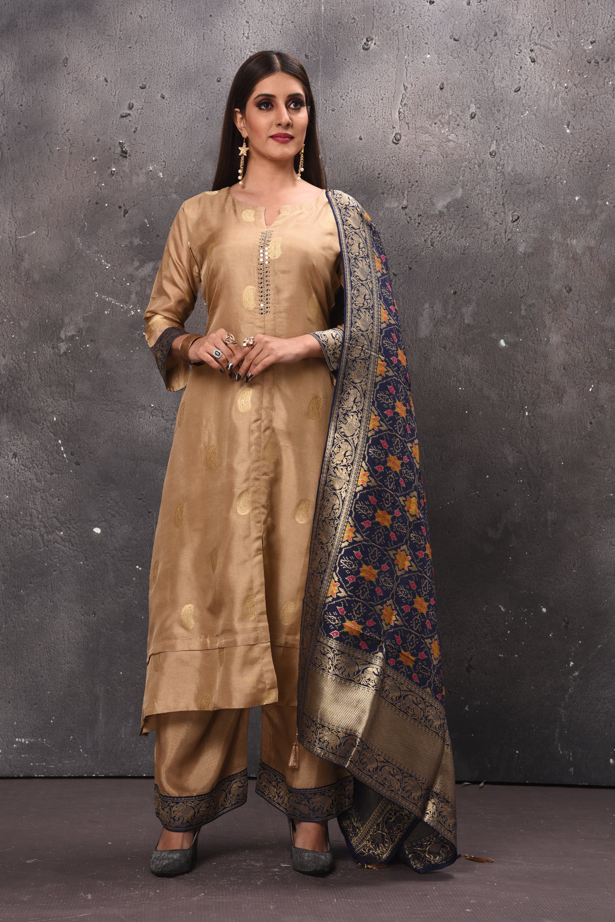 Shop stunning beige designer palazzo suit online in USA with blue Banarasi dupatta. Get set for weddings and festive occasions in exclusive designer Anarkali suits, wedding gown, salwar suits, gharara suits, Indowestern dresses from Pure Elegance Indian fashion store in USA.-full view