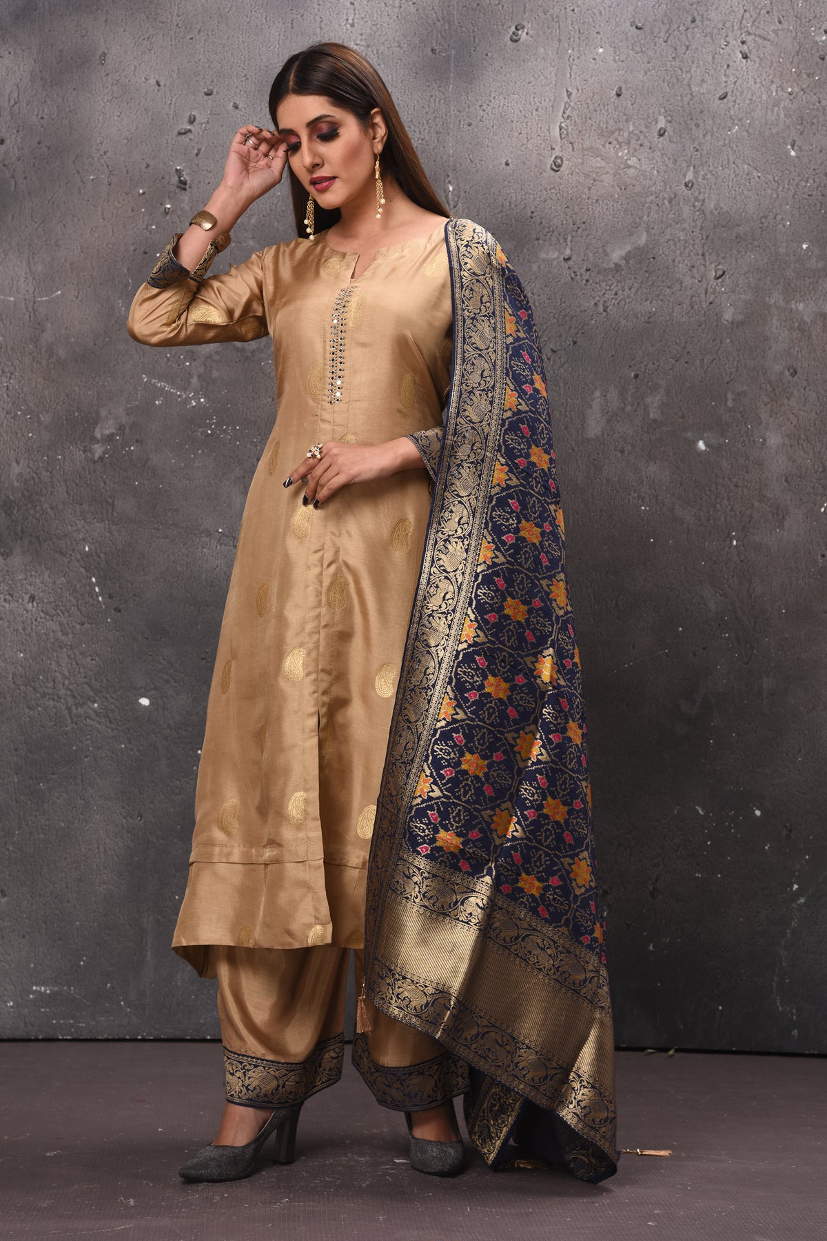 Shop stunning beige designer palazzo suit online in USA with blue Banarasi dupatta. Get set for weddings and festive occasions in exclusive designer Anarkali suits, wedding gown, salwar suits, gharara suits, Indowestern dresses from Pure Elegance Indian fashion store in USA.-side