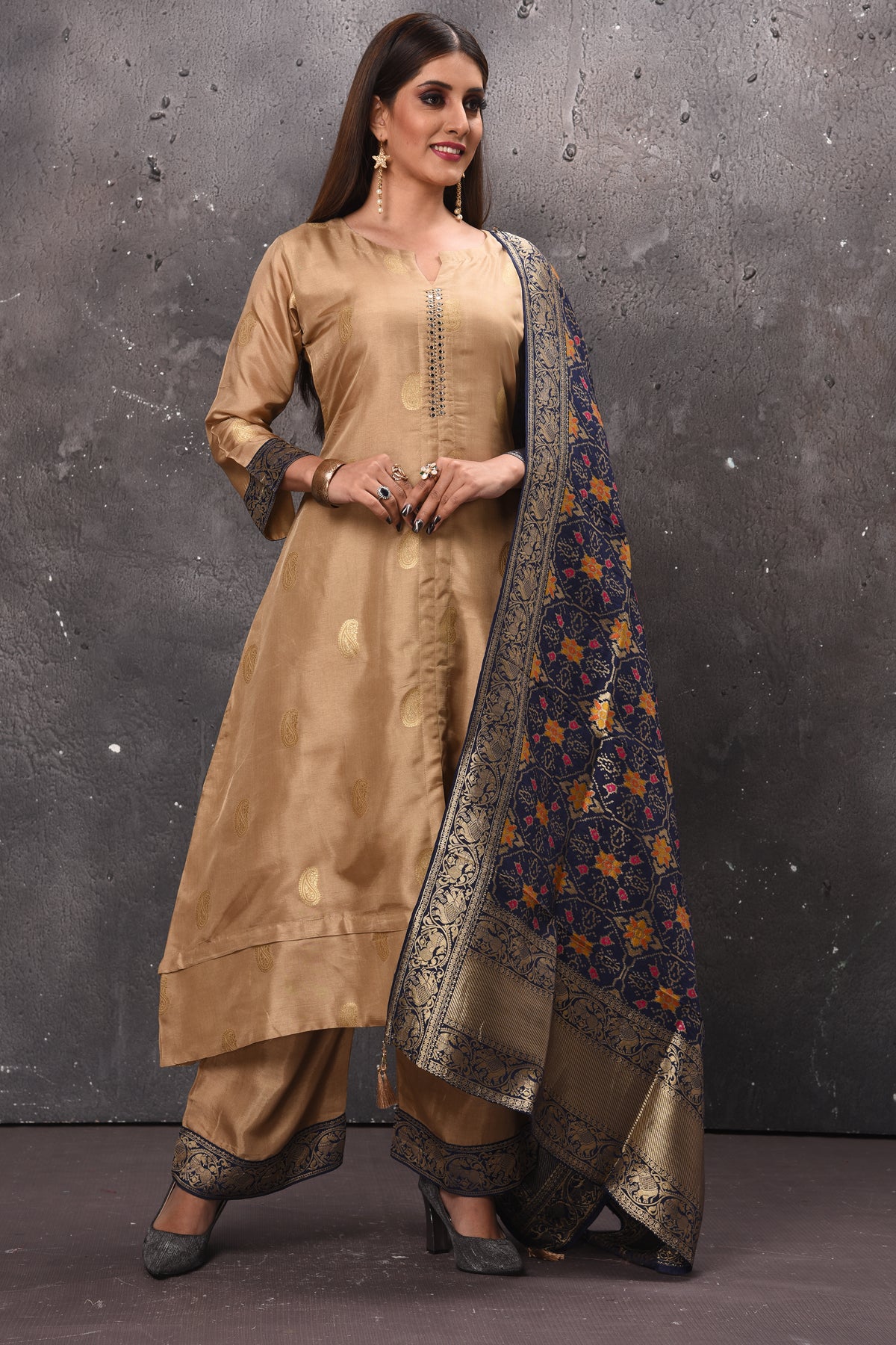 Shop stunning beige designer palazzo suit online in USA with blue Banarasi dupatta. Get set for weddings and festive occasions in exclusive designer Anarkali suits, wedding gown, salwar suits, gharara suits, Indowestern dresses from Pure Elegance Indian fashion store in USA.-front