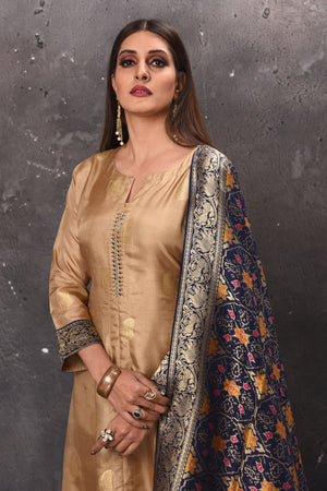 Shop stunning beige designer palazzo suit online in USA with blue Banarasi dupatta. Get set for weddings and festive occasions in exclusive designer Anarkali suits, wedding gown, salwar suits, gharara suits, Indowestern dresses from Pure Elegance Indian fashion store in USA.-closeup