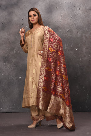 Shop beautiful beige palazzo suit online in USA with red Banarasi dupatta. Get set for weddings and festive occasions in exclusive designer Anarkali suits, wedding gown, salwar suits, gharara suits, Indowestern dresses from Pure Elegance Indian fashion store in USA.-side