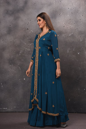 Buy stunning blue embroidered layered Anarkali suit online in USA. Get set for weddings and festive occasions in exclusive designer Anarkali suits, wedding gown, salwar suits, gharara suits, Indowestern dresses from Pure Elegance Indian fashion store in USA.-side