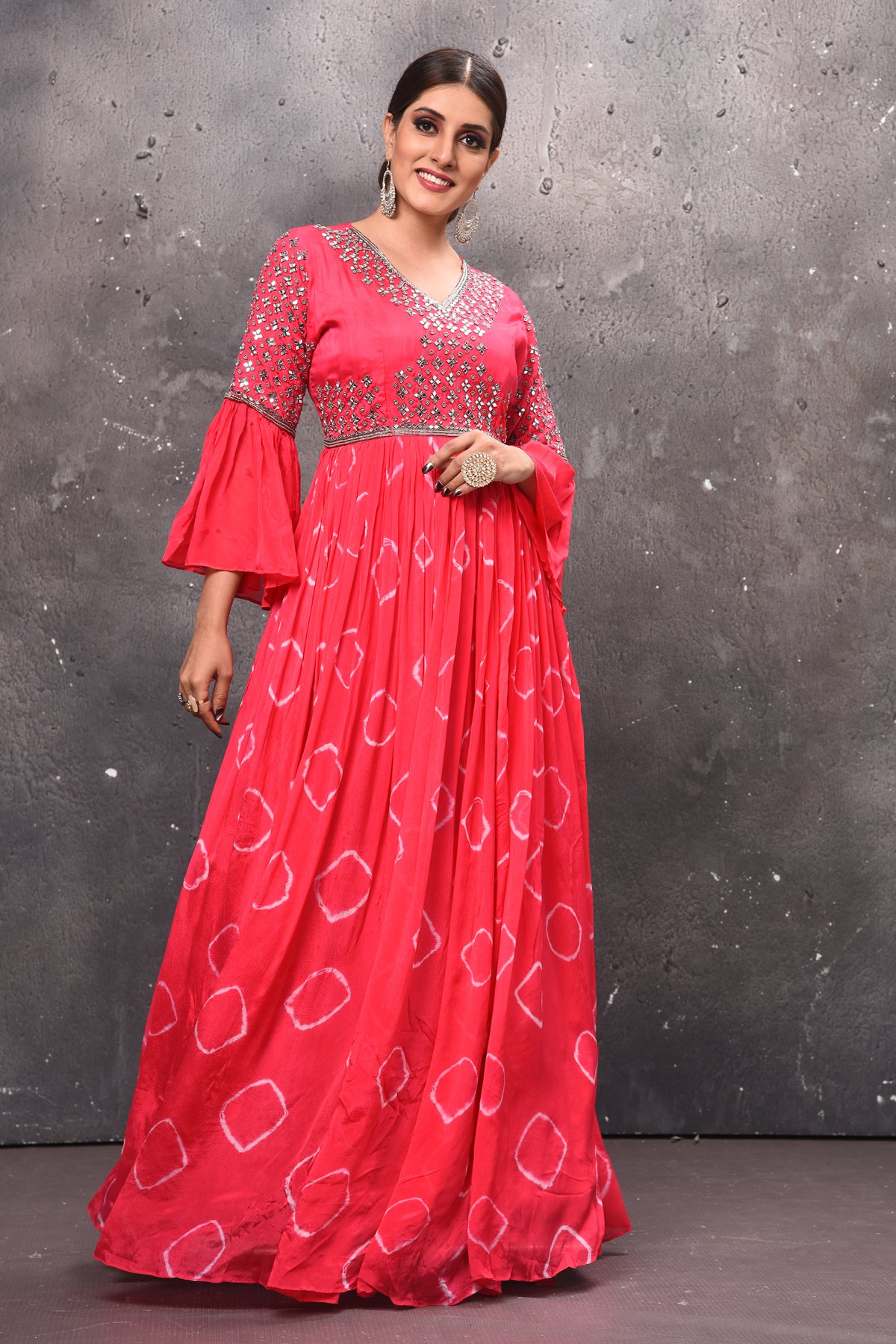 Shop beautiful pink mirror work and tie and dye gown online in USA with bell sleeves. Get set for weddings and festive occasions in exclusive designer Anarkali suits, wedding gown, salwar suits, gharara suits, Indowestern dresses from Pure Elegance Indian fashion store in USA.-side