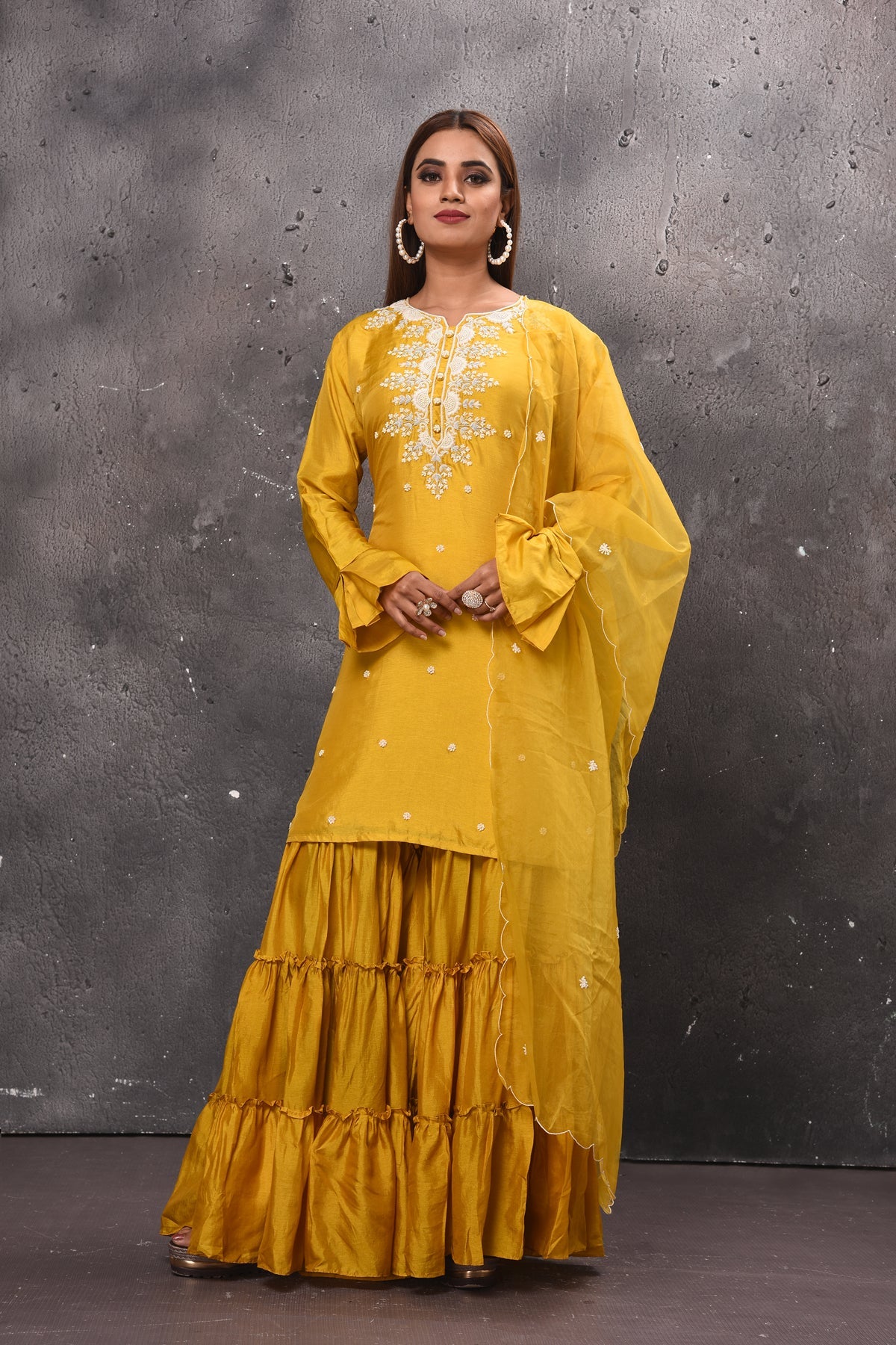 Shop beautiful yellow tiered sharara suit online in USA with dupatta. Get set for weddings and festive occasions in exclusive designer Anarkali suits, wedding gown, salwar suits, gharara suits, Indowestern dresses from Pure Elegance Indian fashion store in USA.-full view