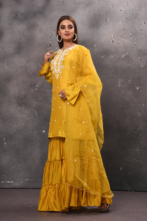 Shop beautiful yellow tiered sharara suit online in USA with dupatta. Get set for weddings and festive occasions in exclusive designer Anarkali suits, wedding gown, salwar suits, gharara suits, Indowestern dresses from Pure Elegance Indian fashion store in USA.-left