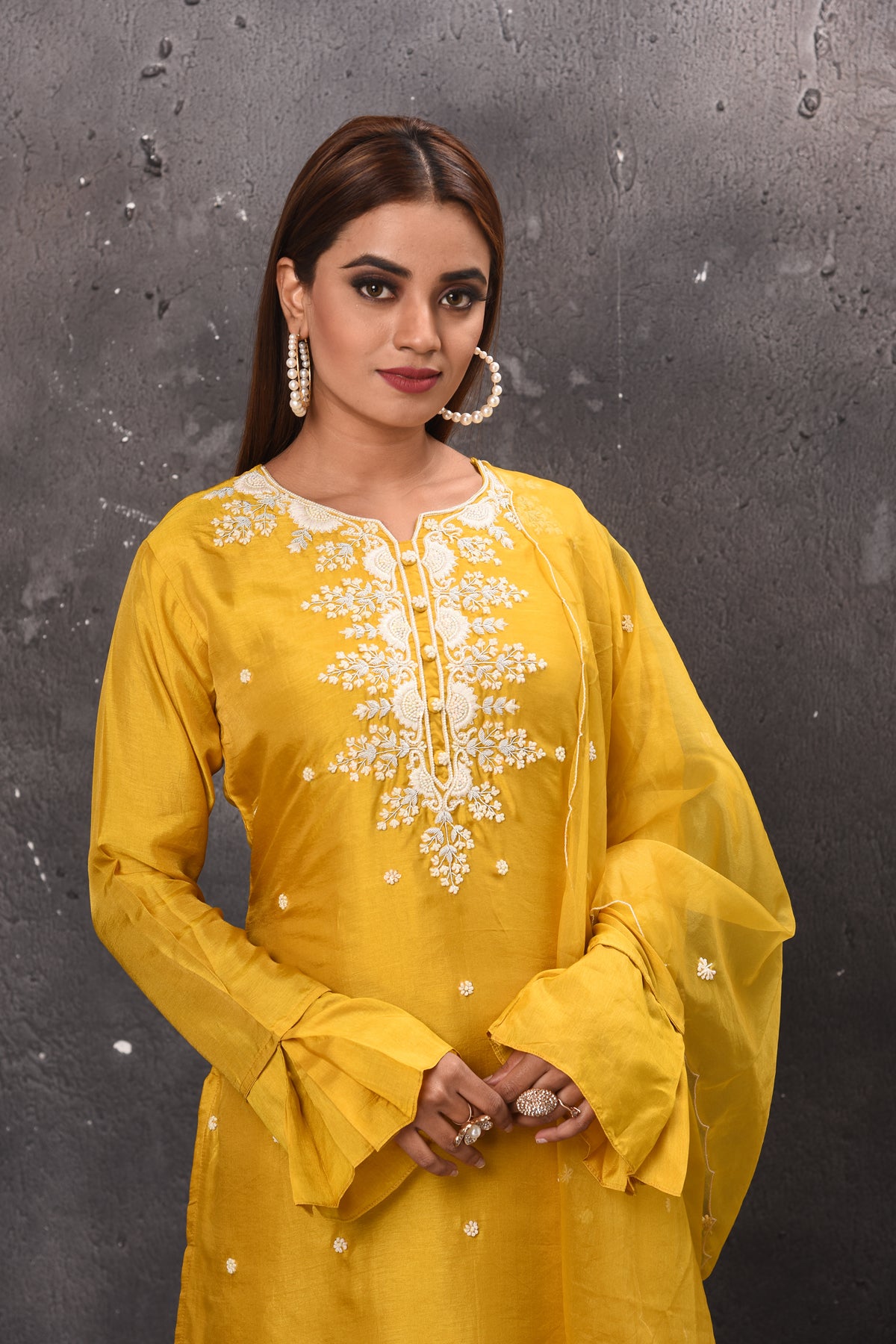 Shop beautiful yellow tiered sharara suit online in USA with dupatta. Get set for weddings and festive occasions in exclusive designer Anarkali suits, wedding gown, salwar suits, gharara suits, Indowestern dresses from Pure Elegance Indian fashion store in USA.-closeup