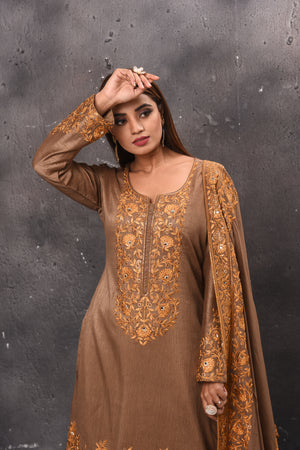 Shop stunning beige embroidered sharara suit online in USA with dupatta. Get set for weddings and festive occasions in exclusive designer Anarkali suits, wedding gown, salwar suits, gharara suits, Indowestern dresses from Pure Elegance Indian fashion store in USA.-closeup