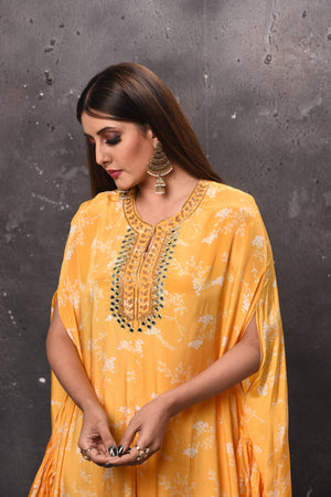 Shop beautiful yellow printed kaftan suit online in USA with palazzo. Get set for weddings and festive occasions in exclusive designer Anarkali suits, wedding gown, salwar suits, gharara suits, Indowestern dresses from Pure Elegance Indian fashion store in USA.-closeup