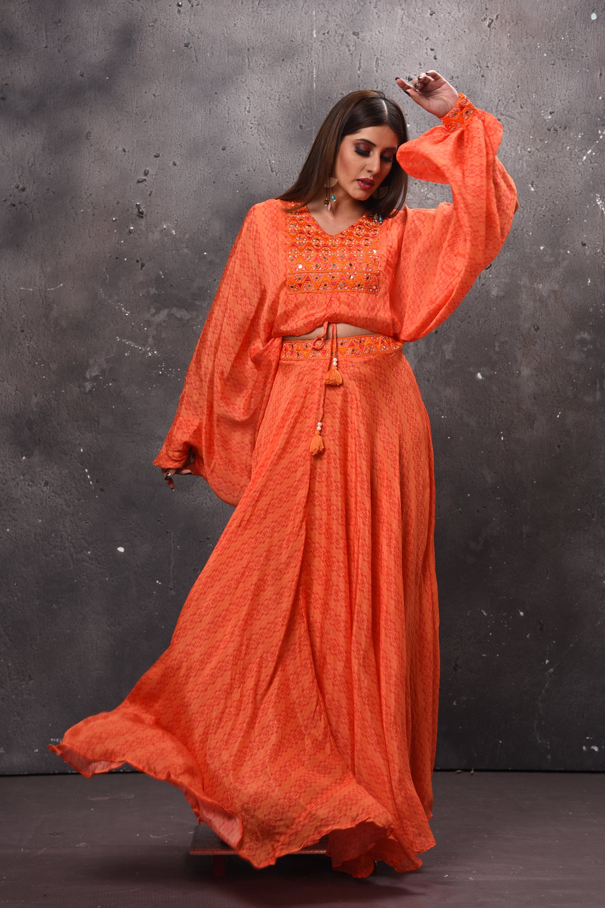 Shop beautiful orange mirror work skirt set online in USA. Get set for weddings and festive occasions in exclusive designer Anarkali suits, wedding gown, salwar suits, gharara suits, Indowestern dresses from Pure Elegance Indian fashion store in USA.-full view