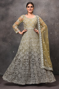 Shop beautiful olive green embroidered floorlength Anarkali suit online in USA with dupatta. Get set for weddings and festive occasions in exclusive designer Anarkali suits, wedding gown, salwar suits, gharara suits, Indowestern dresses from Pure Elegance Indian fashion store in USA.-full view