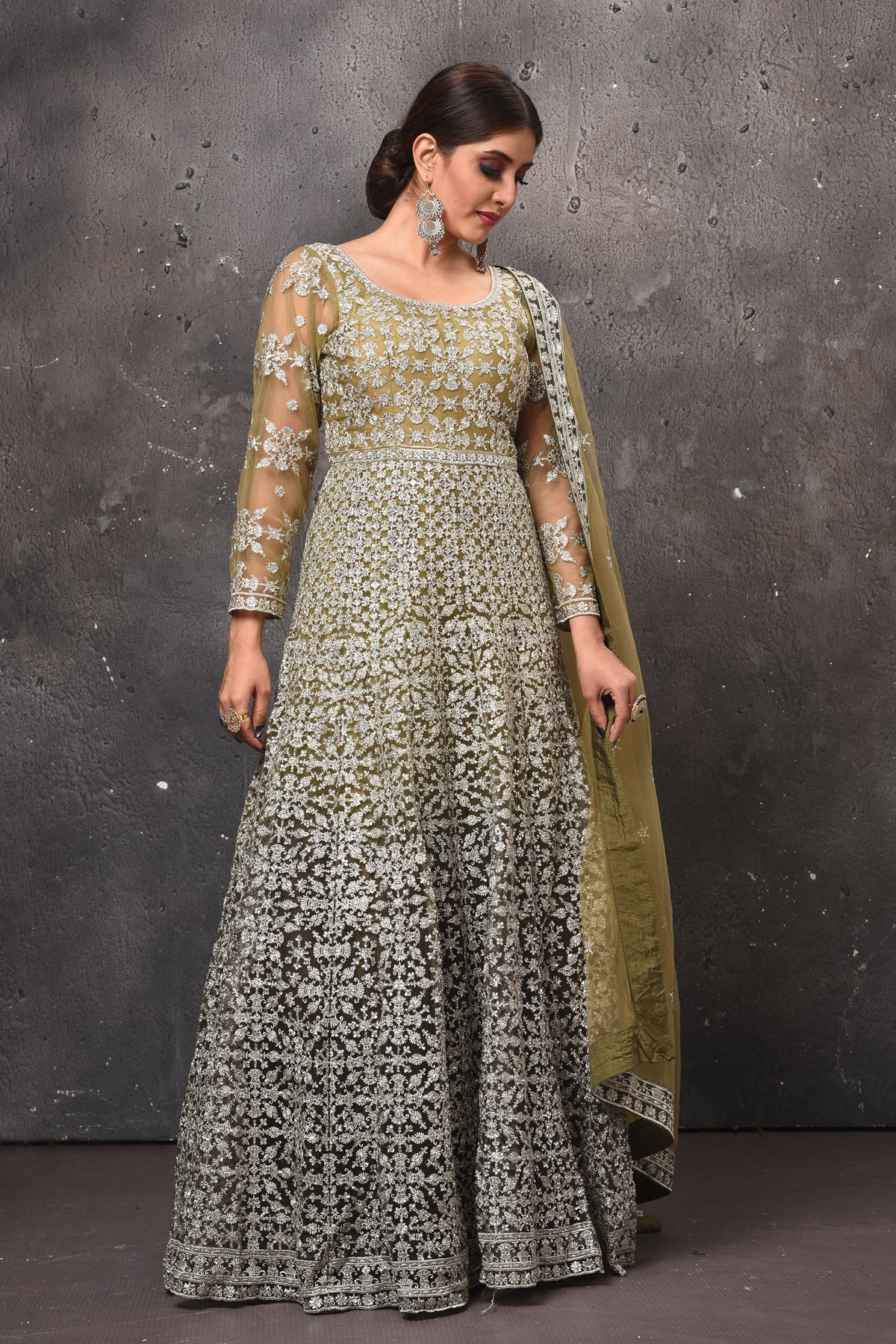 Shop beautiful olive green embroidered floorlength Anarkali suit online in USA with dupatta. Get set for weddings and festive occasions in exclusive designer Anarkali suits, wedding gown, salwar suits, gharara suits, Indowestern dresses from Pure Elegance Indian fashion store in USA.-front