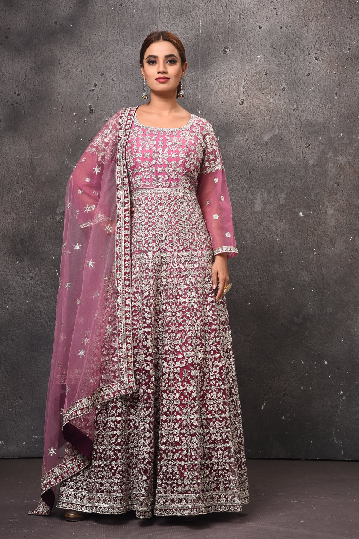 Buy stunning mauvish pink embroidered floorlength Anarkali suit online in USA with dupatta. Get set for weddings and festive occasions in exclusive designer Anarkali suits, wedding gown, salwar suits, gharara suits, Indowestern dresses from Pure Elegance Indian fashion store in USA.-full view