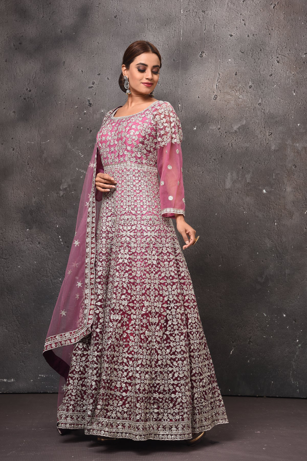 Buy stunning mauvish pink embroidered floorlength Anarkali suit online in USA with dupatta. Get set for weddings and festive occasions in exclusive designer Anarkali suits, wedding gown, salwar suits, gharara suits, Indowestern dresses from Pure Elegance Indian fashion store in USA.-side
