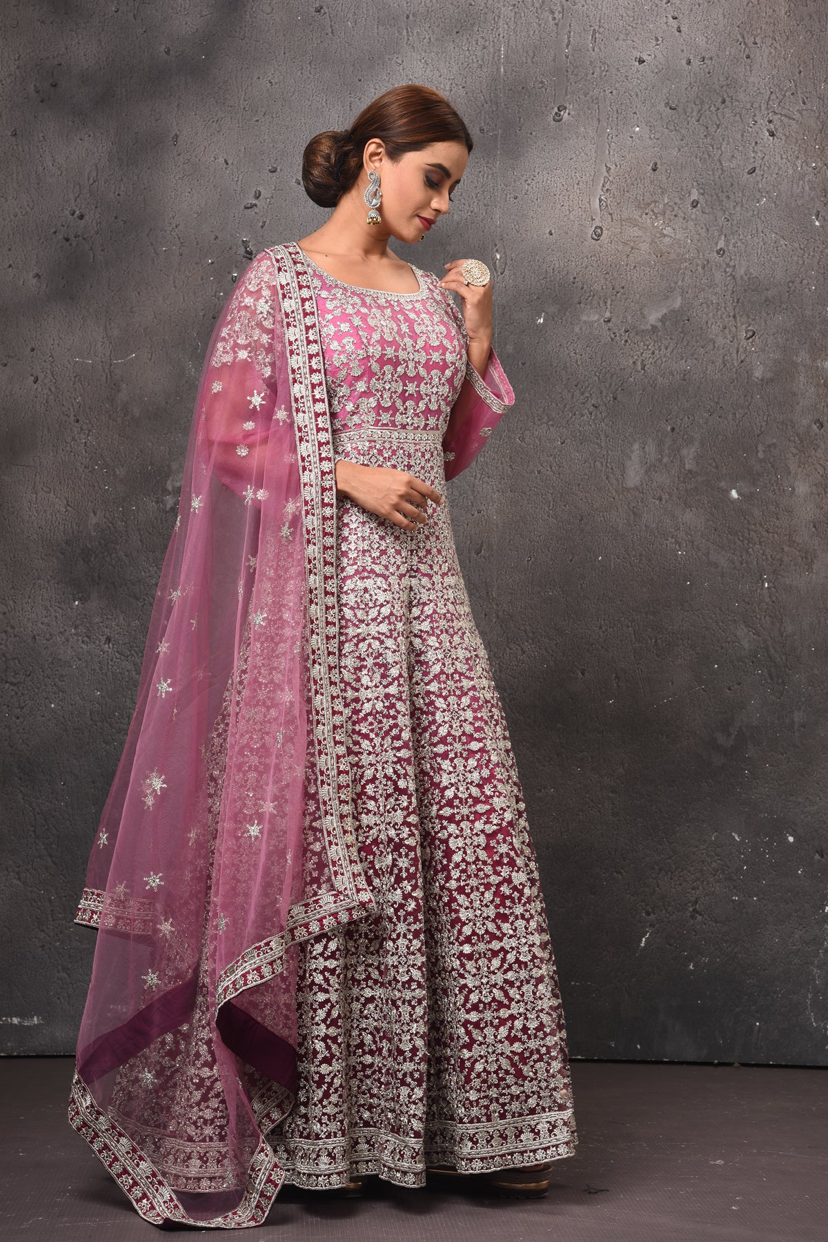 Buy stunning mauvish pink embroidered floorlength Anarkali suit online in USA with dupatta. Get set for weddings and festive occasions in exclusive designer Anarkali suits, wedding gown, salwar suits, gharara suits, Indowestern dresses from Pure Elegance Indian fashion store in USA.-right