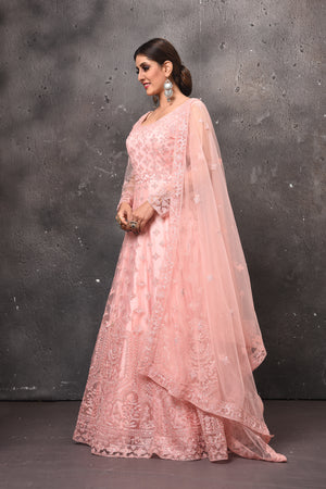 Buy beautiful light pink embroidered net Anarkali suit online in USA with dupatta. Get set for weddings and festive occasions in exclusive designer Anarkali suits, wedding gown, salwar suits, gharara suits, Indowestern dresses from Pure Elegance Indian fashion store in USA.-side