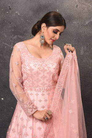 Buy beautiful light pink embroidered net Anarkali suit online in USA with dupatta. Get set for weddings and festive occasions in exclusive designer Anarkali suits, wedding gown, salwar suits, gharara suits, Indowestern dresses from Pure Elegance Indian fashion store in USA.-closeup