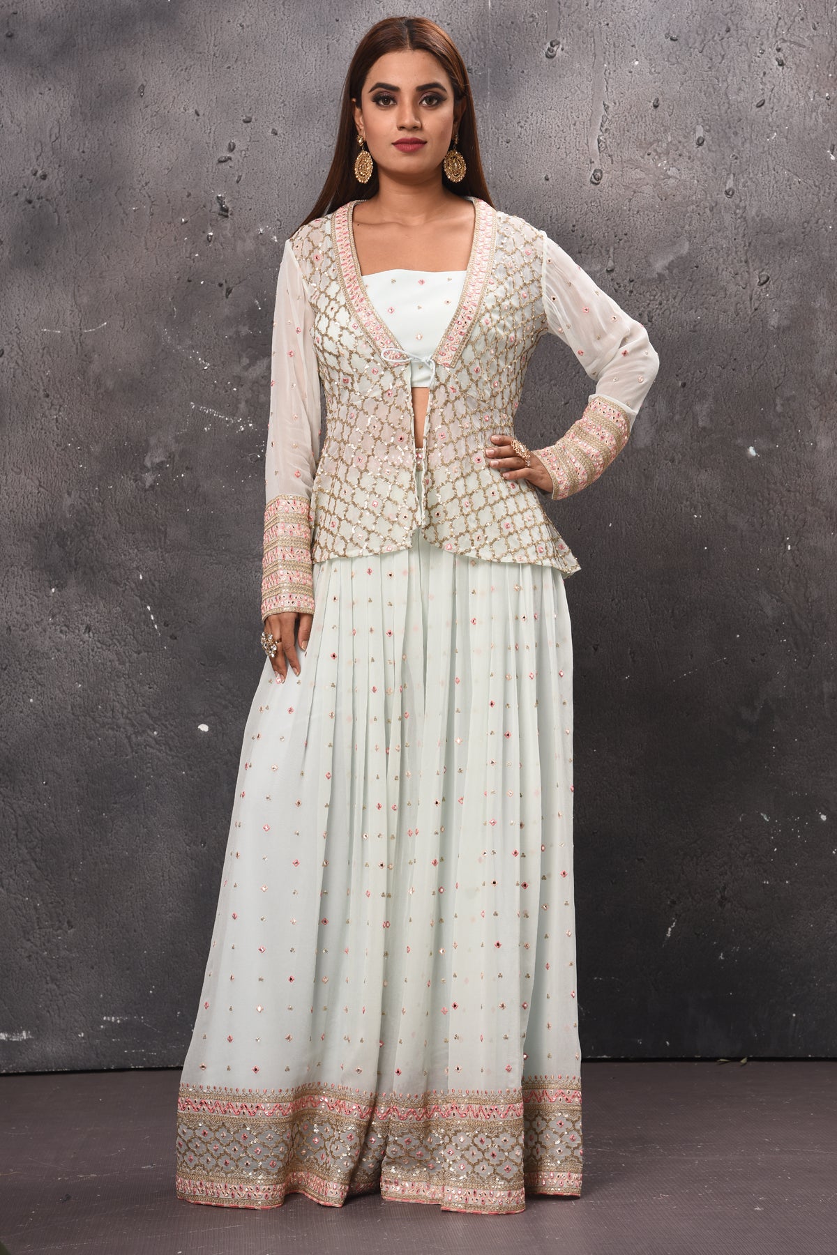 Shop beautiful white embroidered palazzo online in USA with crop top and jacket. Get set for weddings and festive occasions in exclusive designer Anarkali suits, wedding gown, salwar suits, gharara suits, Indowestern dresses from Pure Elegance Indian fashion store in USA.-full view