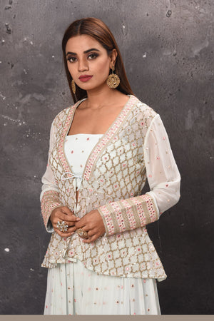 Shop beautiful white embroidered palazzo online in USA with crop top and jacket. Get set for weddings and festive occasions in exclusive designer Anarkali suits, wedding gown, salwar suits, gharara suits, Indowestern dresses from Pure Elegance Indian fashion store in USA.-closeup