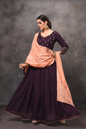 Shop beautiful aubergine embroidered Anarkali suit online in USA with peach dupatta. Get set for weddings and festive occasions in exclusive designer Anarkali suits, wedding gown, salwar suits, gharara suits, Indowestern dresses from Pure Elegance Indian fashion store in USA.-front