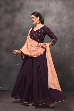 Shop beautiful aubergine embroidered Anarkali suit online in USA with peach dupatta. Get set for weddings and festive occasions in exclusive designer Anarkali suits, wedding gown, salwar suits, gharara suits, Indowestern dresses from Pure Elegance Indian fashion store in USA.-side