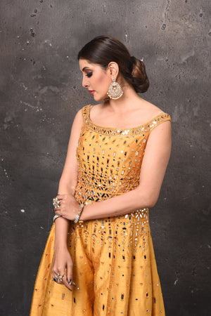 Shop stunning mango yellow embroidered palazzo and crop top online in USA. Get set for weddings and festive occasions in exclusive designer Anarkali suits, wedding gown, salwar suits, gharara suits, Indowestern dresses from Pure Elegance Indian fashion store in USA.-closeup