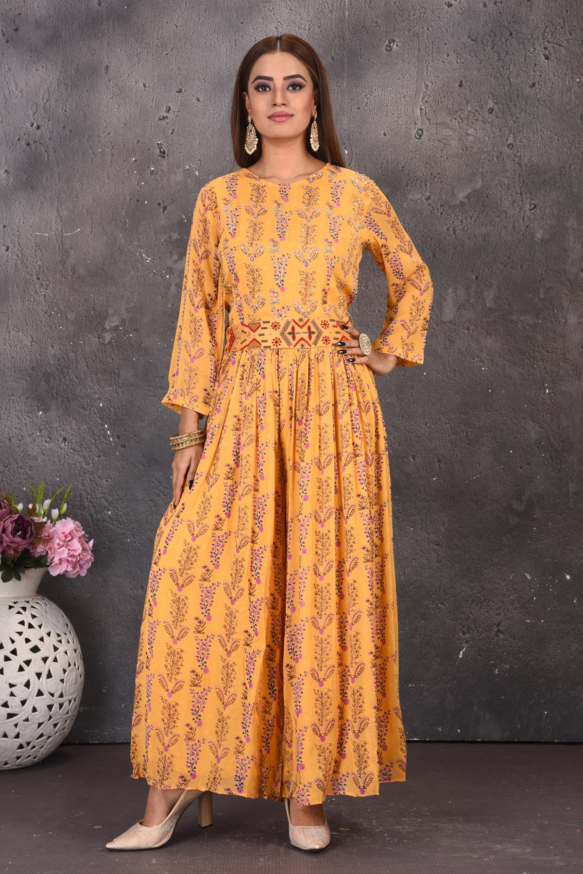 Shop beautiful yellow printed jumpsuit online in USA with multicolor embroidery waistband. Look stylish at parties and wedding festivities in designer dresses, Indowestern outfits, Anarkali suits, wedding lehengas, palazzo suits, sharara suits from Pure Elegance Indian clothing store in USA.-full view