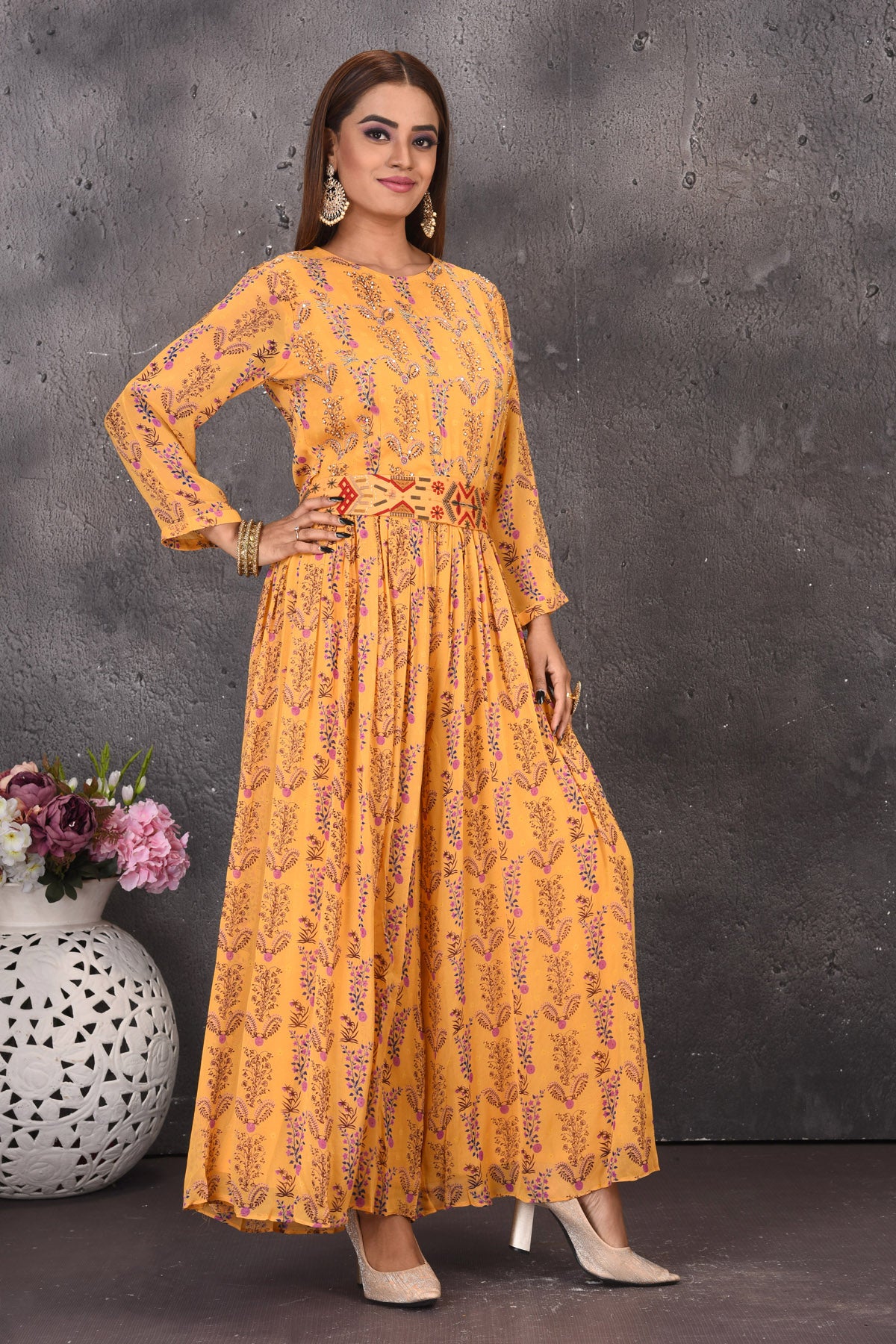 Shop beautiful yellow printed jumpsuit online in USA with multicolor embroidery waistband. Look stylish at parties and wedding festivities in designer dresses, Indowestern outfits, Anarkali suits, wedding lehengas, palazzo suits, sharara suits from Pure Elegance Indian clothing store in USA.-right