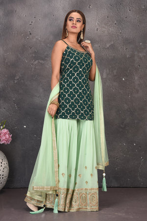 Buy beautiful dark and mint green embroidered sharara suit online in USA with dupatta. Look stylish at parties and wedding festivities in designer dresses, Indowestern outfits, Anarkali suits, wedding lehengas, palazzo suits, sharara suits from Pure Elegance Indian clothing store in USA.-side