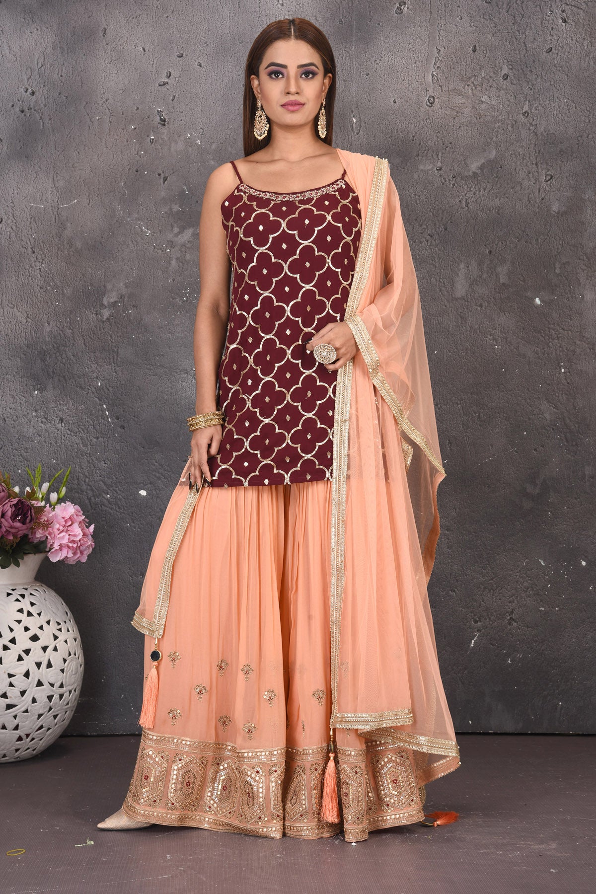 Shop gorgeous maroon and peach embroidered sharara suit online in USA with dupatta. Look stylish at parties and wedding festivities in designer dresses, Indowestern outfits, Anarkali suits, wedding lehengas, palazzo suits, sharara suits from Pure Elegance Indian clothing store in USA.-full view